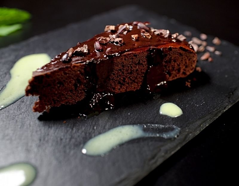 homemade brownie cake with dark and white chocolate cream